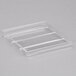 A clear plastic tray with four rows of thin lines.