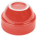 A red Libbey porcelain bowl with a white edge.