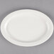 A white oval medium rim porcelain platter on a gray background.