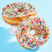 A donut with Adourne Rainbow Sprinkles on it.