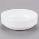 A Libbey Reflections white porcelain bowl on a gray surface.