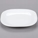 A white Libbey square porcelain plate with a small rim.