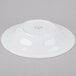 A Libbey white porcelain pasta bowl with a circular rim on a gray surface.