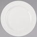 A Libbey ivory porcelain plate with a medium rim on a white background.