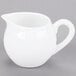 A Libbey Aluma White porcelain creamer with a handle.