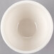 A Libbey ivory porcelain bouillon bowl filled with white liquid.