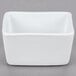 A white rectangular Libbey porcelain sugar caddy with a lid on it.