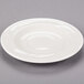 A white plate with a bowl shape.