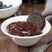 A Libbey white porcelain custard bowl filled with chocolate pudding, Oreos, and berries.