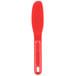 A red plastic sandwich spreader with a round ball on the end.