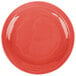 A red Libbey Cantina porcelain plate with a wavy circular design.