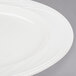 A Libbey ivory porcelain plate with a medium rim.