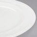 A Libbey ivory porcelain plate with a circular rim.