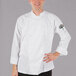 A man wearing a white Mercer Culinary chef jacket.