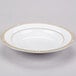 A white Syracuse China bone china soup bowl with gold trim on the rim.