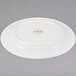 A white Libbey porcelain plate with a medium rim.