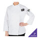 A woman wearing a Mercer Culinary white chef coat.