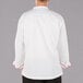The back of a white Mercer Culinary chef's jacket with red piping.
