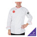 A man wearing a white Mercer Culinary chef coat with red piping.