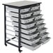 A grey and black cart with 16 small bins.
