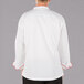 The back of a white Mercer Culinary chef jacket with red piping.