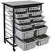 A grey and black Luxor storage bin cart with bins inside.