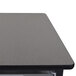 A Luxor mobile bin storage unit with grey metal bins on a grey and black metal frame.