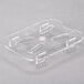 A clear plastic Cambro drain tray with four holes.