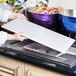 a person holding a tray of food