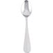 A Libbey stainless steel demitasse spoon with a silver handle.