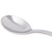 A Libbey stainless steel demitasse spoon with a silver handle.