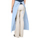 A woman wearing a light blue Intedge bistro apron with 2 pockets.