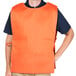 An orange Intedge cobbler apron with 2 pockets.