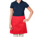 A woman wearing a red Intedge waist apron.