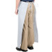 A person wearing an Intedge gray bistro apron with 2 pockets.