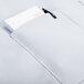 A pocket with a pen and a piece of paper in an Intedge gray bistro apron.