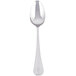 A Libbey stainless steel serving spoon with a silver handle.