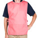 A man wearing a mauve Intedge cobbler apron.
