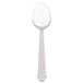 A Libbey stainless steel dessert spoon with a white handle.