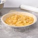 A pie in a D&W Fine Pack extra-deep foil pie pan on a counter.