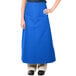 A woman wearing a blue Intedge bistro apron.