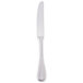 A silver Libbey stainless steel dinner knife with a white handle on a white background.