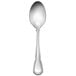 A silver demitasse spoon with a Baroque handle.