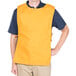 A man wearing a yellow Intedge cobbler apron.