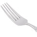 A Libbey stainless steel dinner fork with a silver handle.