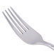 A close-up of a Libbey stainless steel dessert/salad fork with a silver handle.