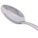 A Libbey stainless steel demitasse spoon with a silver handle.