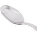 A World Tableware Zephyr teaspoon with a silver handle.