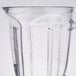 A clear Waring blender jar.