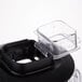 A Waring black and clear plastic blender jar on a blender.